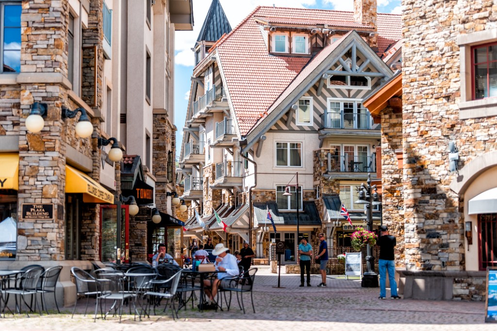 Small town Mountain Village in Colorado with street heritage plaza and stone buildings architecture