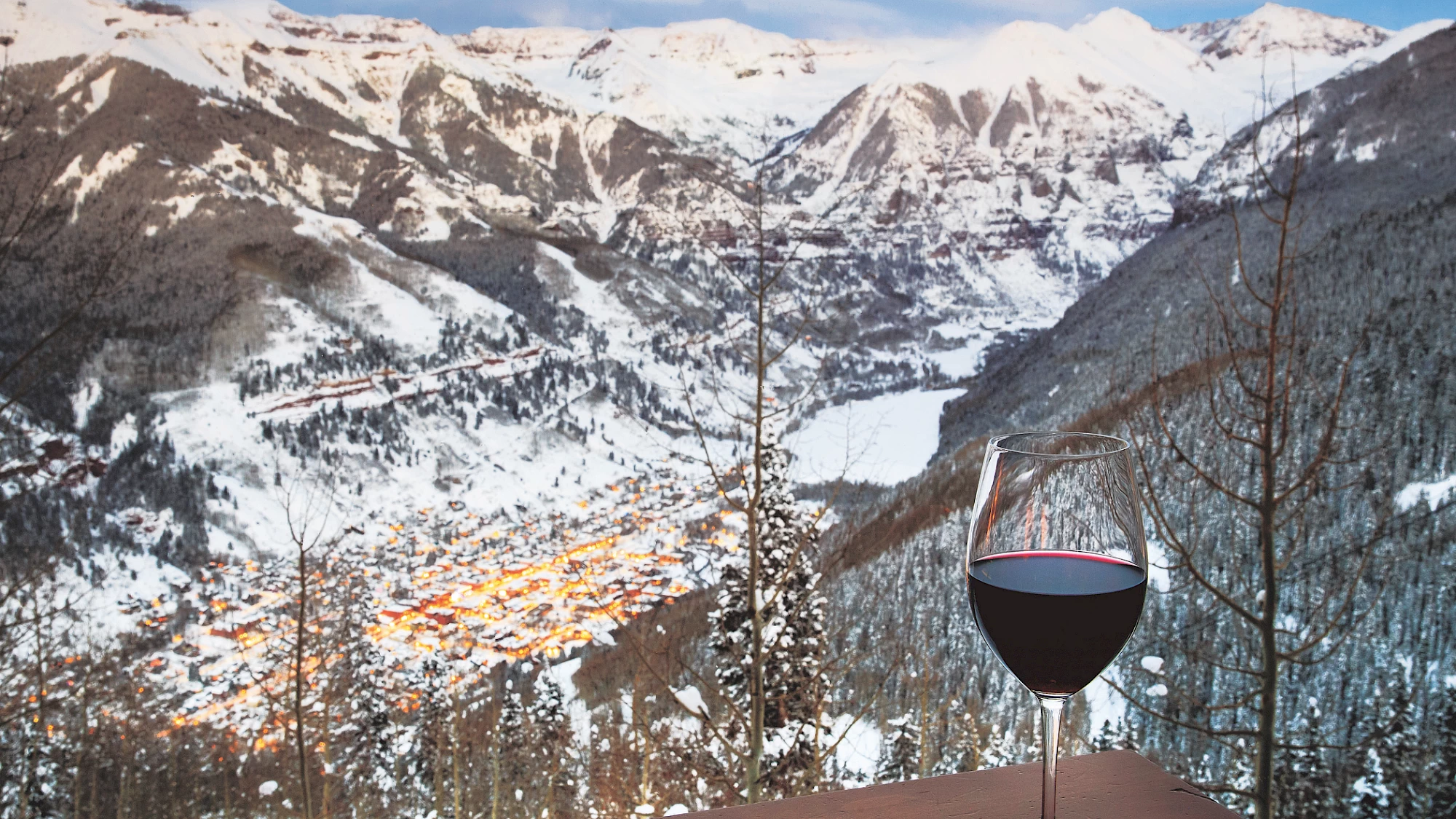 Image of wine glass overlooking Telluride Ski Resort | Allred's Restaurant