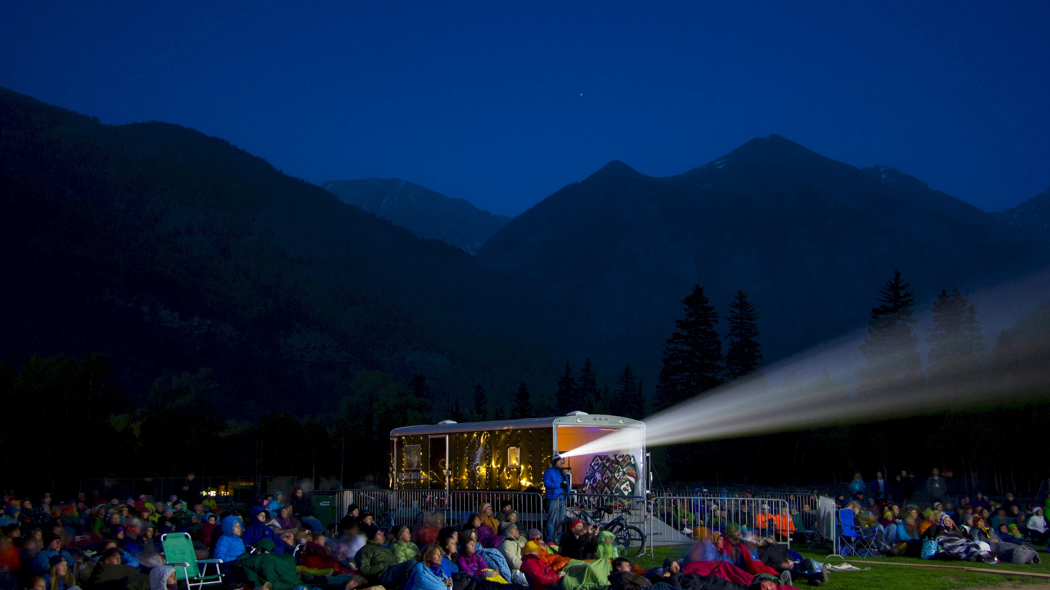 image of a large group of people watching an outdoor film | Mountainfilm Telluride