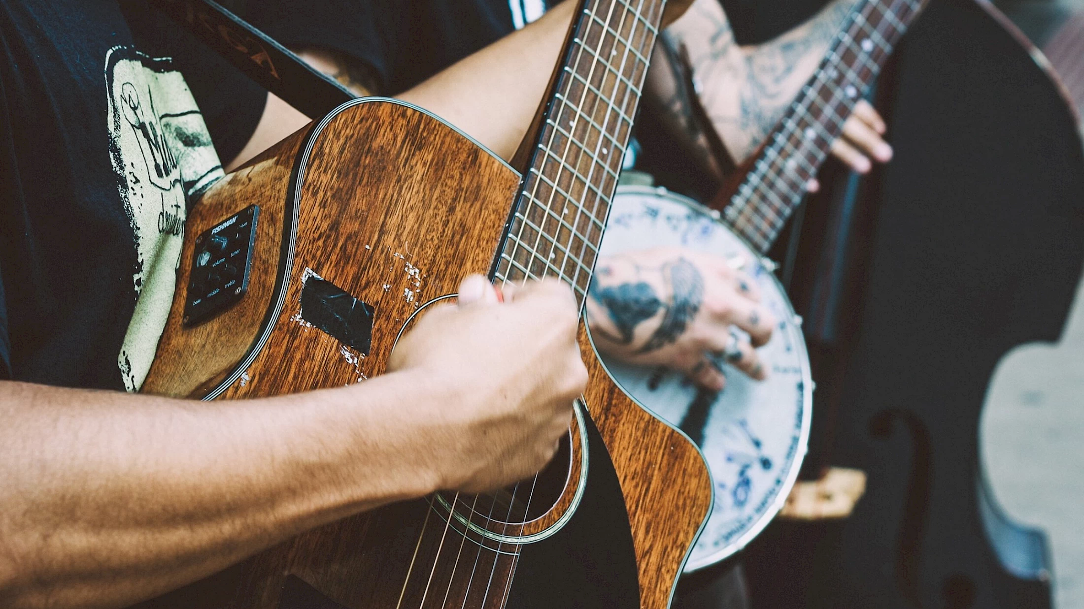 close up image of guitar playing for the Telluride Americana Music Festival